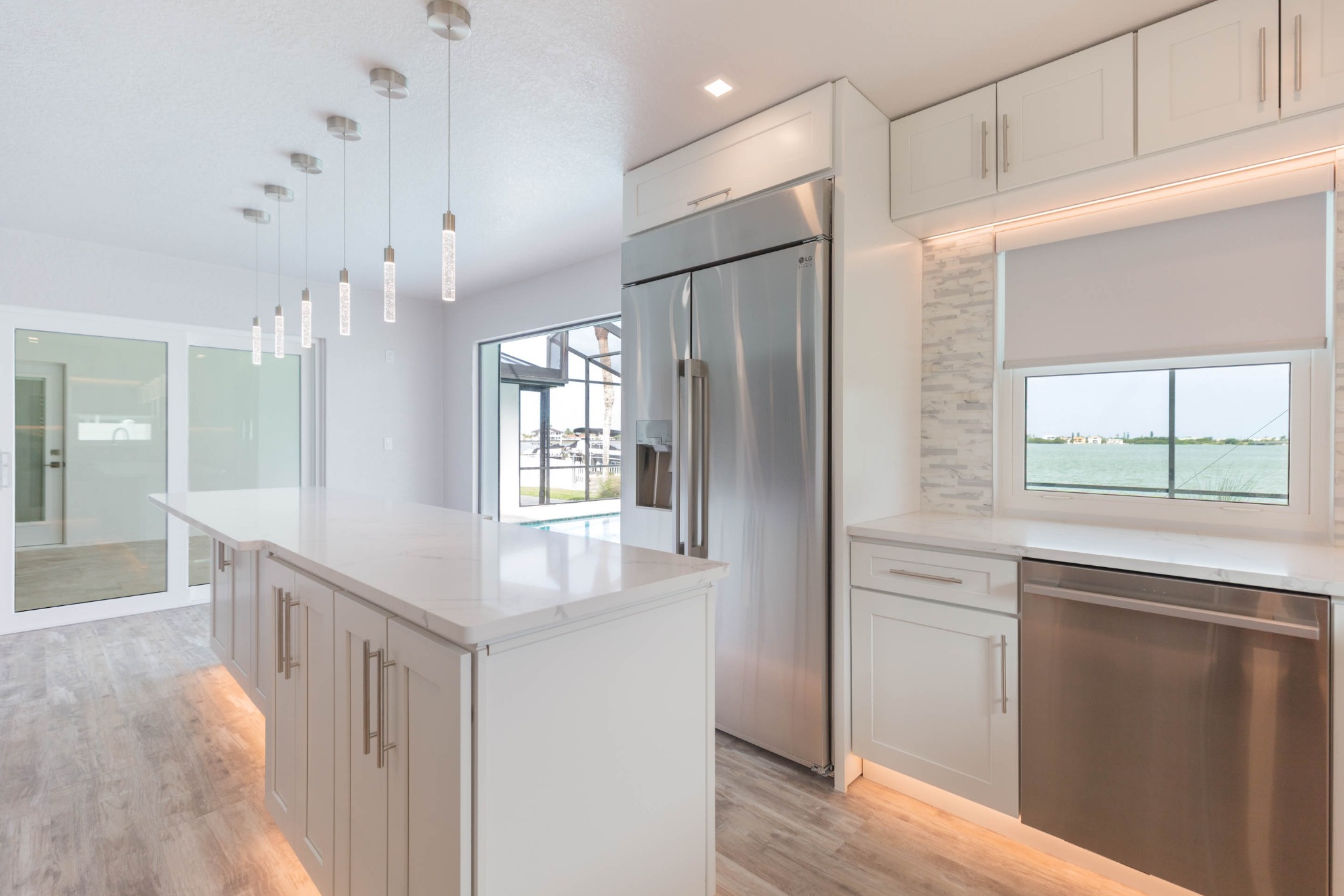 Kitchen overlooking pool and waterfront