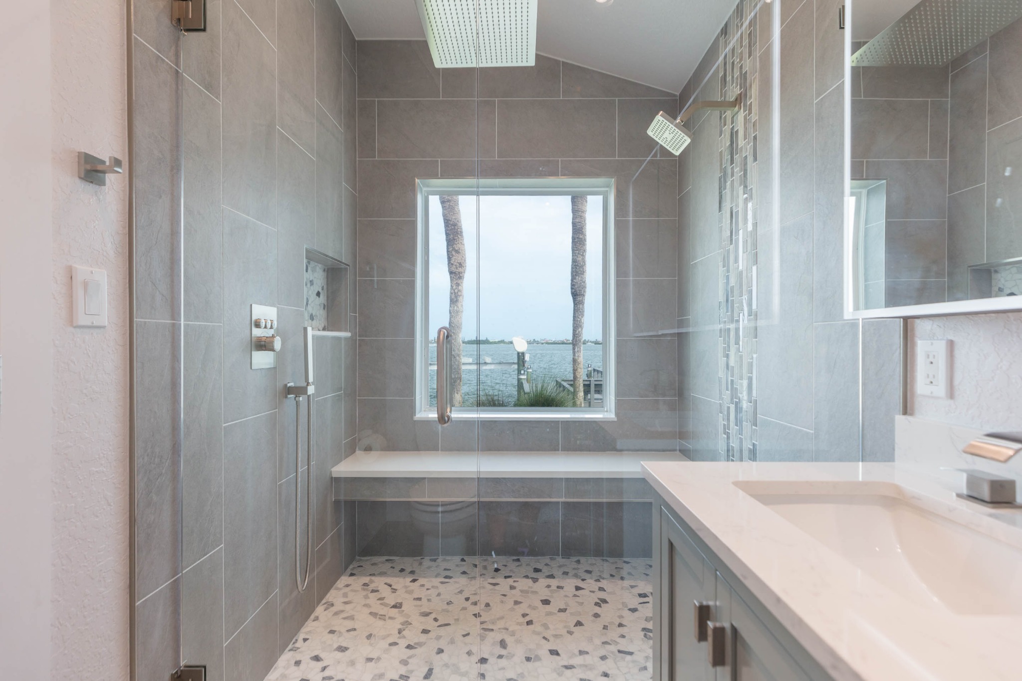 Primary shower with open-water view