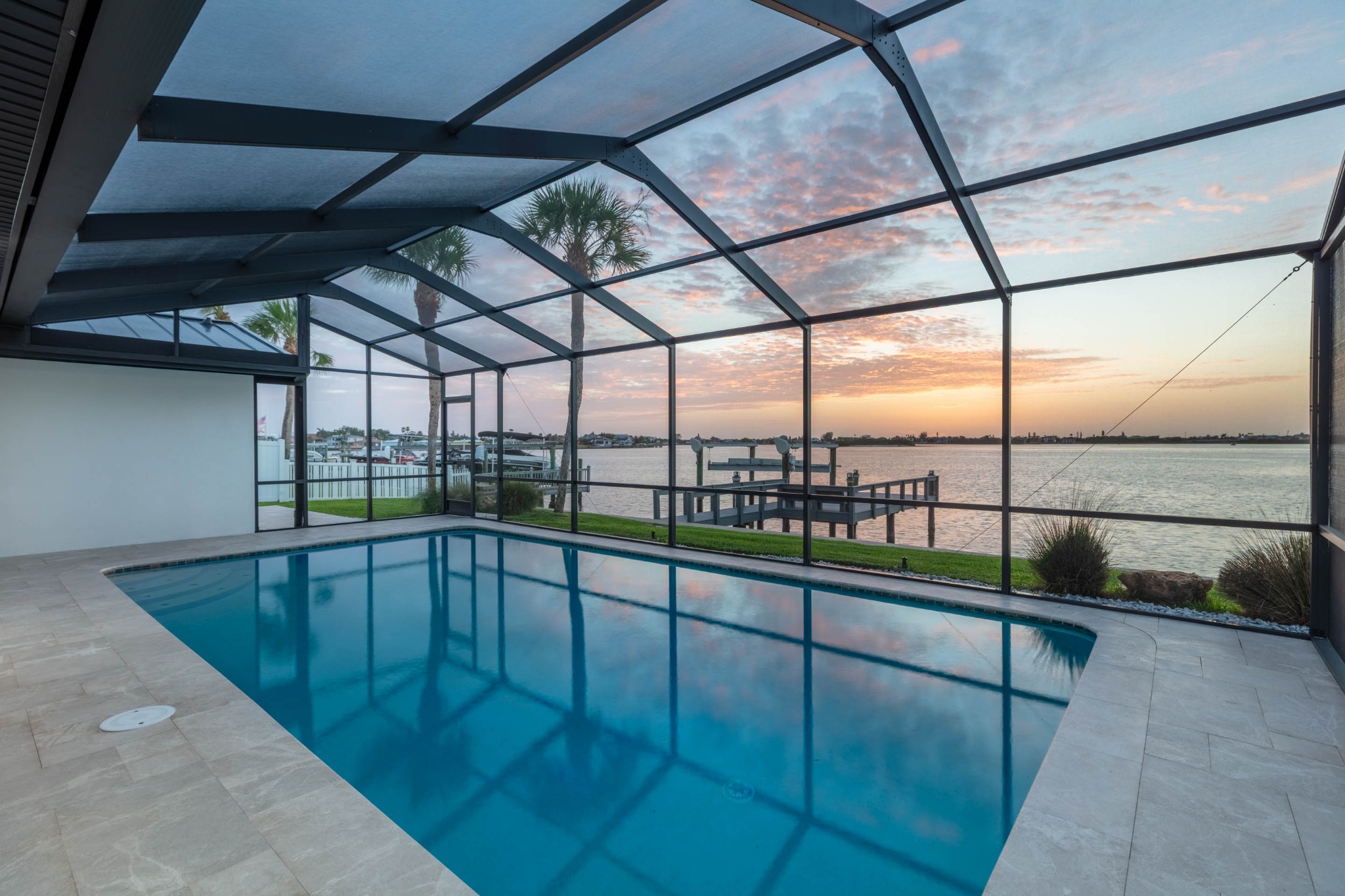 Pool and waterfront at sunset